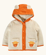 A frugi baby hooded cardigan jacket in cream sherpa with an orange corduroy hood, trim, and front placket. The hood has two cow ears, and the front pockets feature embroidered Scottish Highland cow faces.