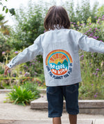 Frugi kids shacket, shirt with blue and white stripes and rainbow design worn by a child