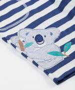 Close up of the Frugi kids sunny koala big stripe short showing an appliqué of a grey koala on the side on navy and white organic cotton fabric