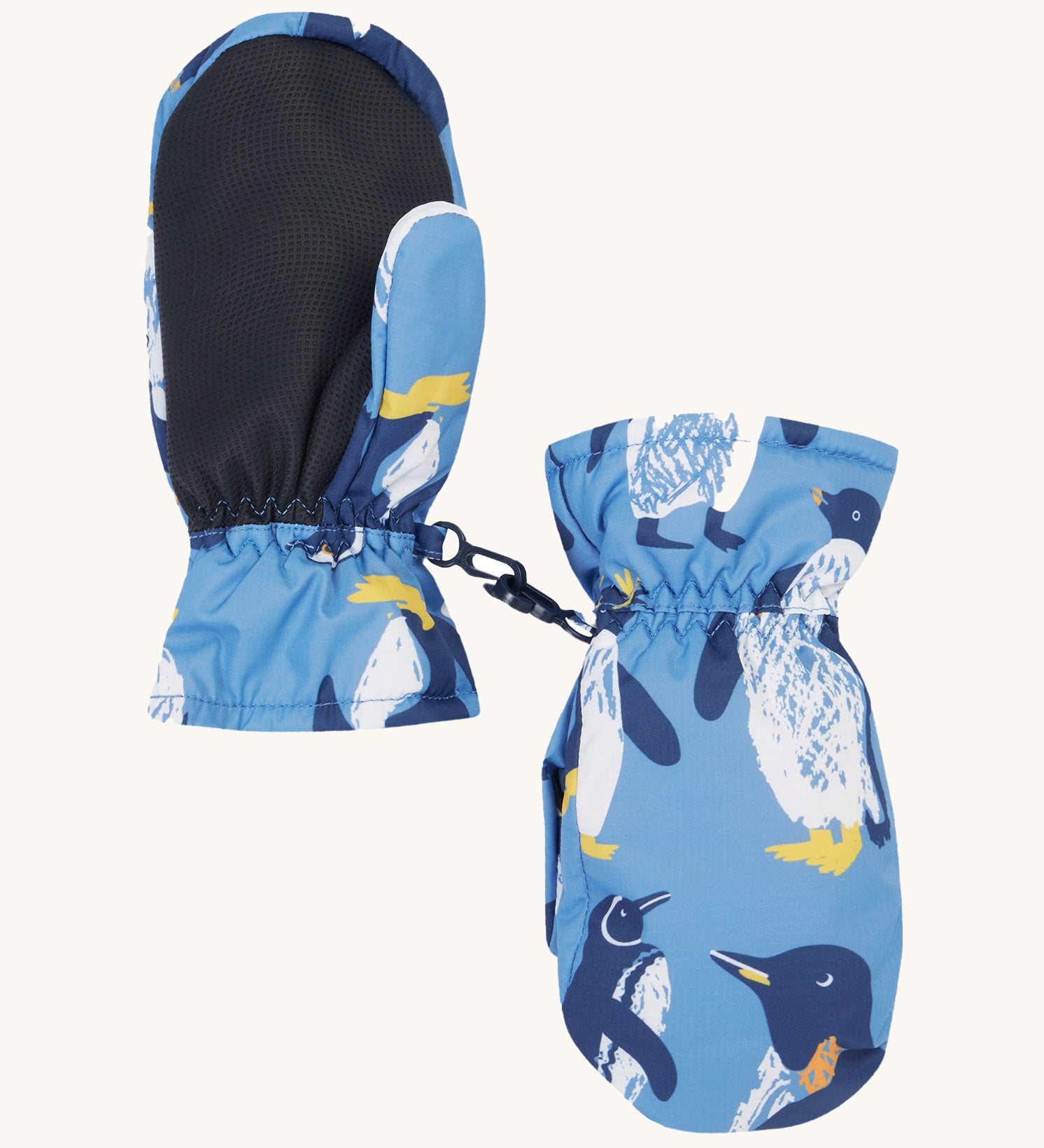 The back of the Frugi kids penguin waddle snow mittens. Showing the grippy palm detail on recycled polyester fabric.