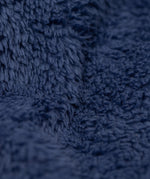 A close up of the thick warm navy fleece from the Frugi kids snapdragon/navy 3 in 1  waterproof rambler coat