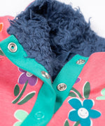 A close up of the navy coloured fleece lining on the Frugi tulip pink kids snuggle fleece with a fun flowers design. 