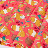 Close up of the skirt on the Frugi Sofia skater dress in pink with an all over guinea pig muddle print. 