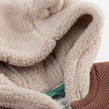 A close up of the Frugi kids ted cord snuggle suit showing the hood detail with cute bear like ears 