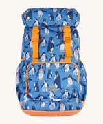 Frugi kids trail blazing backpack in penguin waddle. A blue outdoor backpack with orange trim and multiple penguin prints. Features a flip top main compartment and zipped compartment in the front with 2 bottle holders. 