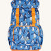 Frugi kids trail blazing backpack in penguin waddle. A blue outdoor backpack with orange trim and multiple penguin prints. Features a flip top main compartment and zipped compartment in the front with 2 bottle holders. 