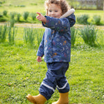 A closer look at the pop fasteners on the Frugi Children's Little Waterproof Dungarees - Navy Blue