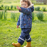 A closer look at the pop fasteners on the Frugi Children's Little Waterproof Dungarees - Navy Blue