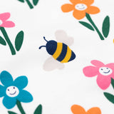 Frugi Sundown organic cotton fun flowers pyjamas. A multi-coloured flower print on a crisp white cotton background.