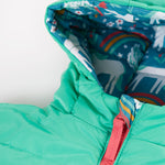 A child undoing the zipper on the Frugi Reversible Toasty Trail Jacket - Wild Horses. The turquoise side is shown in the image