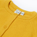 A close up of the collar of the Frugi yellow koala organic knitted cotton cardigan 
