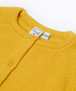 A close up of the collar of the Frugi yellow koala organic knitted cotton cardigan 