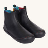 Frugi lake easy on child's leather shoe boots in black. The rubber soles and toe covers are also black to  match. 