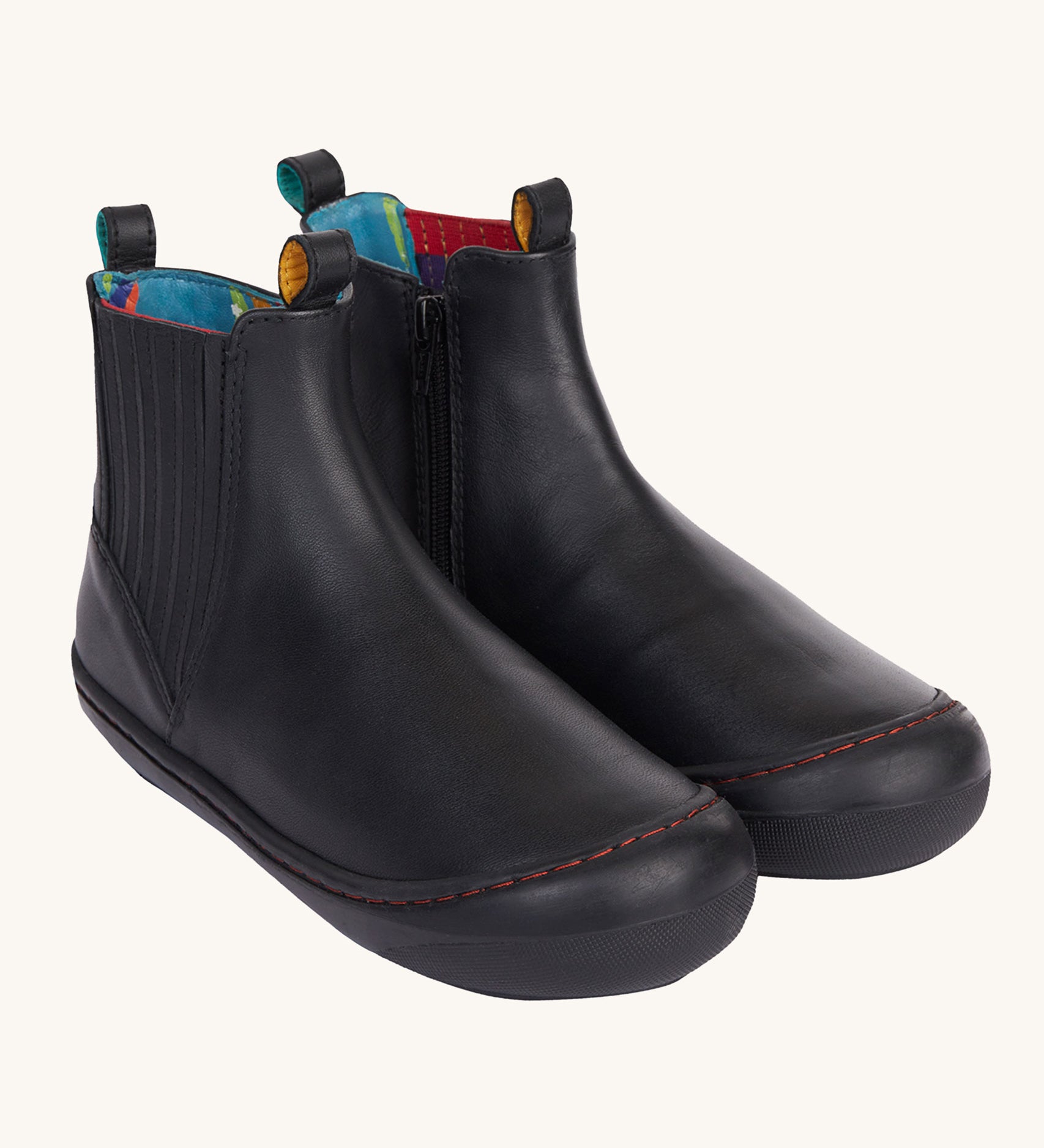 Frugi lake easy on child's leather shoe boots in black. The rubber soles and toe covers are also black to  match. 