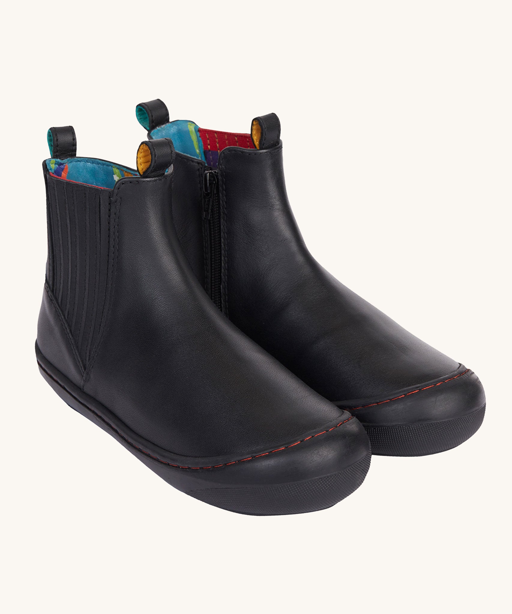 Frugi lake easy on child's leather shoe boots in black. The rubber soles and toe covers are also black to  match. 