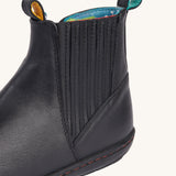 A close up of the stripe details on the side of the Frugi lake easy on child's leather shoe boots in black. 