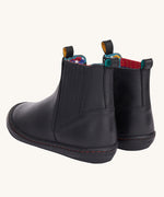 A view of the back of the Frugi lake easy on child's leather shoe boots in black. The boots have a matching black pull tab on them.