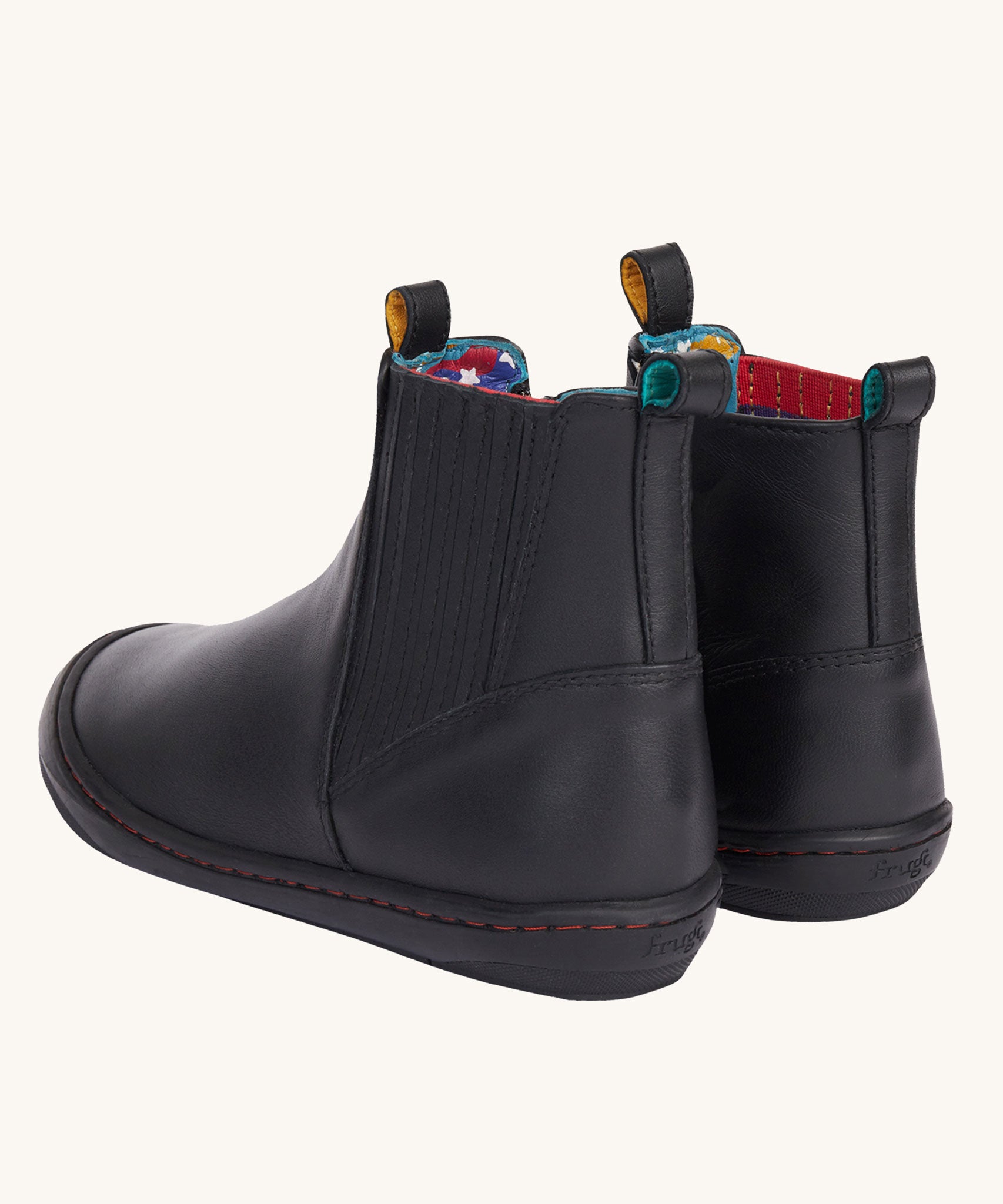 A view of the back of the Frugi lake easy on child's leather shoe boots in black. The boots have a matching black pull tab on them.