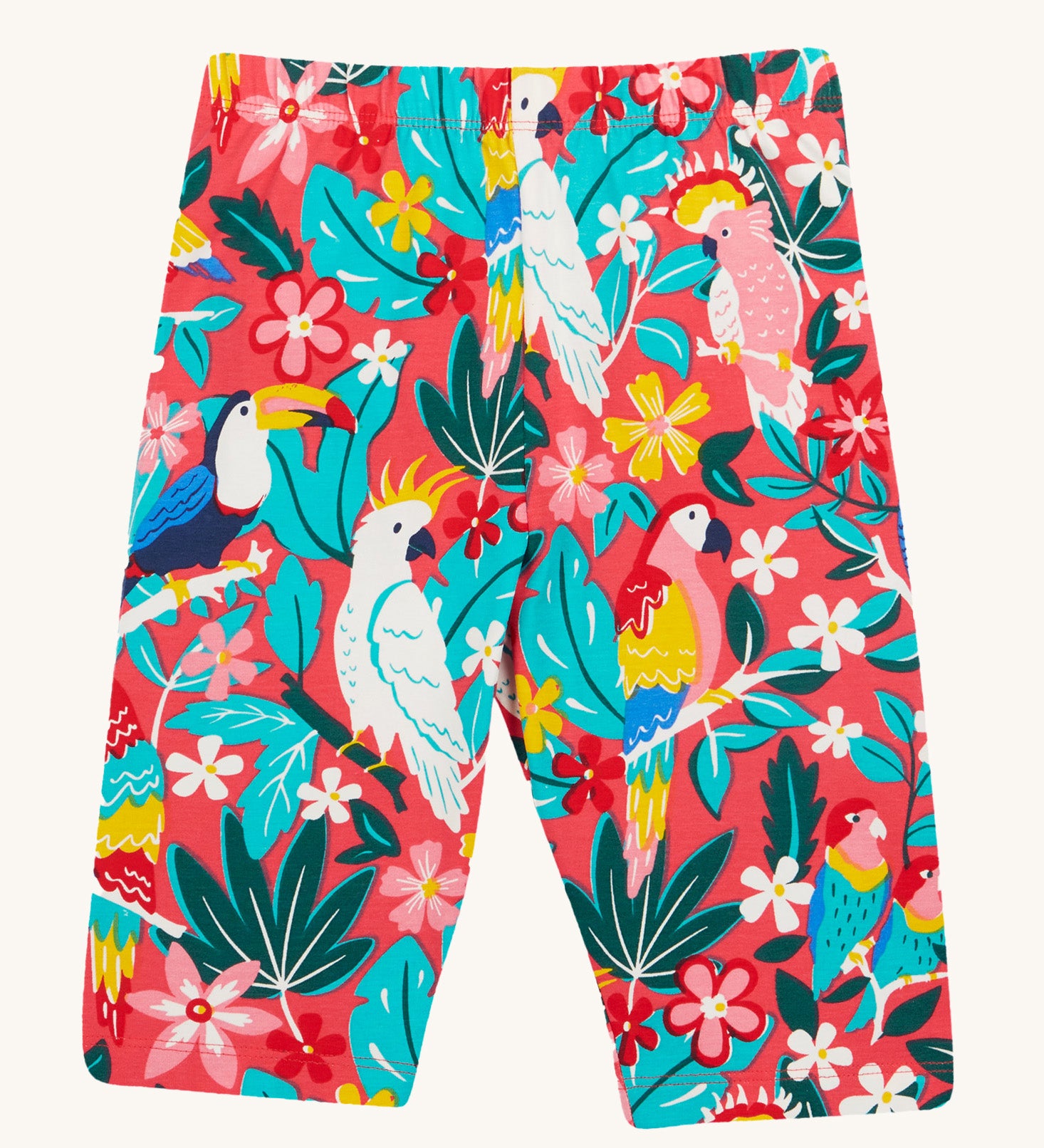 Frugi Laurie Shorts laid flat, with a Birds Of Paradise print, featuring different exotic birds surrounded by colourful flowers and leaves on a pink background.