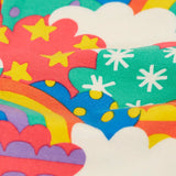 Close up of the soft organic cotton of the Frugi Leona leggings with a colourful fun frenzy print.