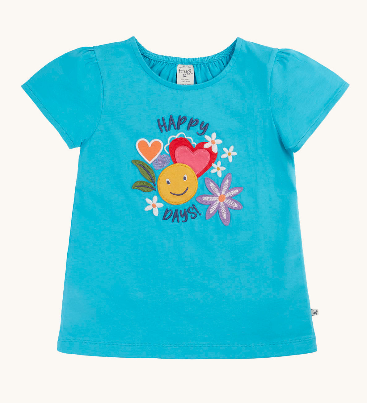 Frugi turquoise blue short puff sleeved children's t-shirt with happy days in navy blue font enveloping a graphic containing a yellow smiley face, pink and red heart and flowers.