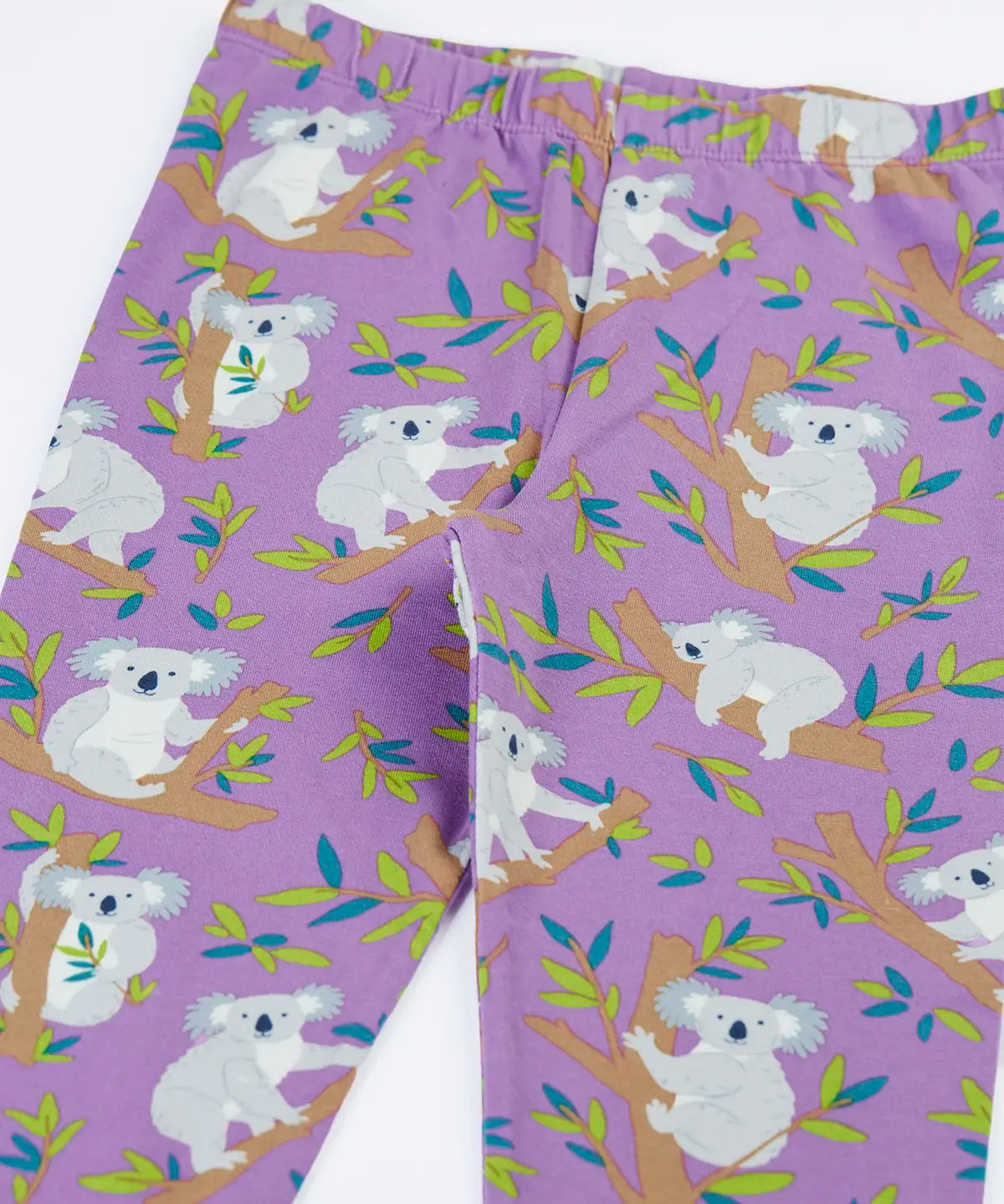 Close up of the Frugi libby purple organic cotton leggings with an all over koala cuddles print.