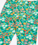 Close up of the Frugi Libby leggings with a wildflower wander all over print 
