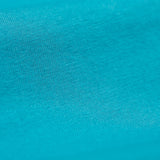 A close up of the Frugi kids libby leggings in boat blue showing the knit detail on bright blue organic cotton fabric.