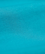 A close up of the Frugi kids libby leggings in boat blue showing the knit detail on bright blue organic cotton fabric.