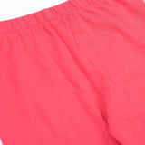 A close up of the Frugi kids libby leggings in rose showing the elasticated waist band detail on bright pink organic cotton fabric.