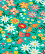 Close up of the floral print on the Frugi Libby leggings with a wildflower wander all over print.
