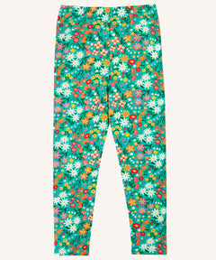 Frugi Libby organic cotton leggings with a wildflower wander all over print on a green background. 