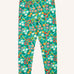 Frugi Libby organic cotton leggings with a wildflower wander all over print on a green background. 