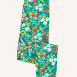 Frugi Libby leggings with a wildflower wander all over print on a green background shown folded. 