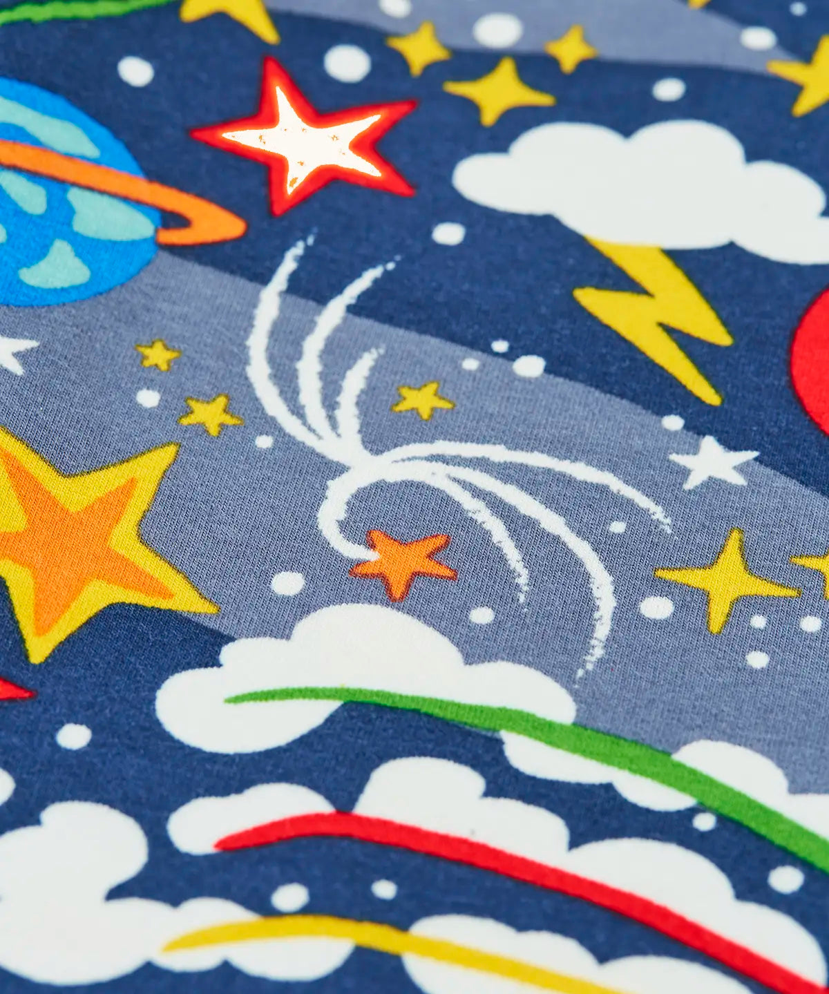 Close up of the print on the Frugi libby navy organic cotton leggings with explore the stars, space themed print. 