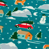 Close up of the winter drives print on the Frugi organic cotton libby leggings. Teal background all over print featuring reindeer, houses, trees and vehicles.