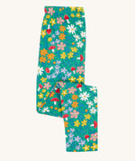 Frugi Libby leggings with a wild woods, botanical design on a green background. 