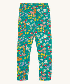 Frugi Libby leggings with a wild woods, botanical design on a green background. 