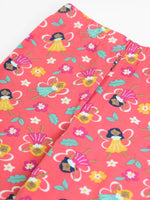 Close up showing the elasticated waistband on the Frugi organic cotton libby leggings with a fairy flutters print. Pink background with all over print featuring fairies and flowers.
