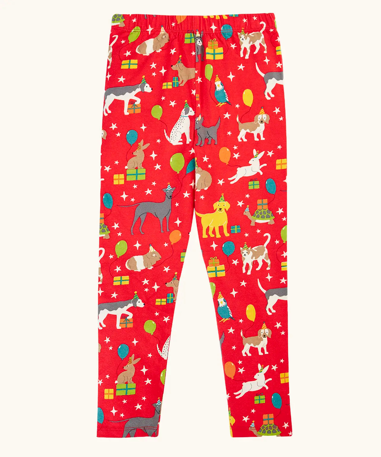 Frugi organic cotton libby leggings with a perfect paw-ty party print. Red background with all over print featuring pets with party hats surrounded by gifts and baloons.
