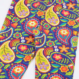 Close up of the Frugi organic cotton libby leggings with a pretty paisley print shown folded. Purple background with all over paisley print featuring flowers.