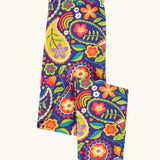 Frugi organic cotton libby leggings with a pretty paisley print shown folded. Purple background with all over paisley print featuring flowers.