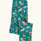 Frugi organic cotton libby leggings with a winter drives print shown folded. Teal background with all over print featuring reindeer, houses, trees and vehicles.