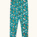 Frugi organic cotton libby leggings with a winter drives print. Teal background with all over print featuring reindeer, houses, trees and vehicles.