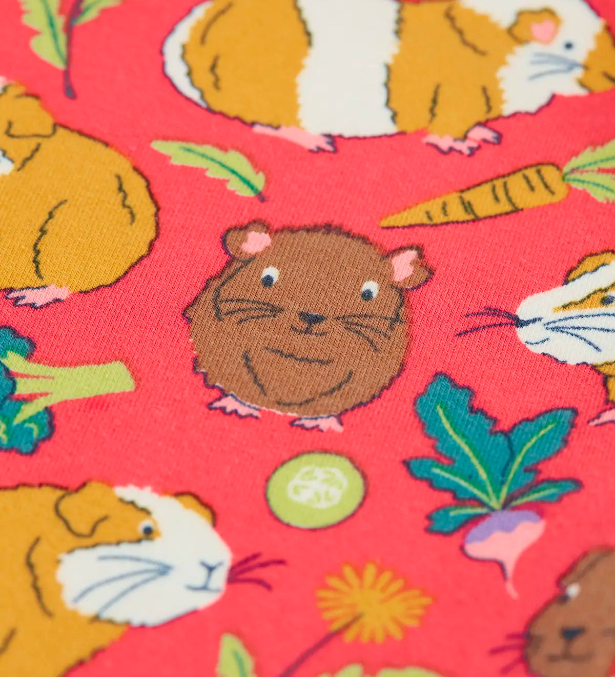 Close up of the guinea pig puddle print on the Frugi libby pink organic cotton  leggings with an all over guinea pig muddle print.