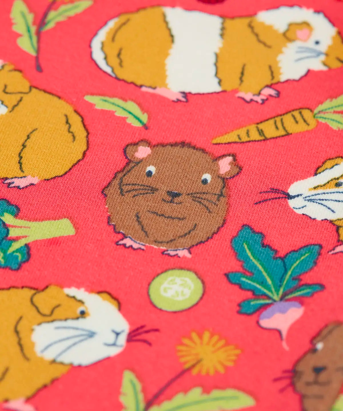 Close up of the guinea pig puddle print on the Frugi libby pink organic cotton  leggings with an all over guinea pig muddle print.