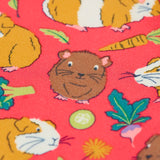 Close up of the guinea pig puddle print on the Frugi libby pink organic cotton  leggings with an all over guinea pig muddle print.