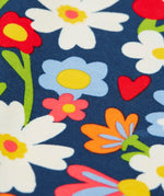 Close up of the print on the Frugi libby beautiful bunch printed organic cotton leggings. Navy coloured background with all over flower print.