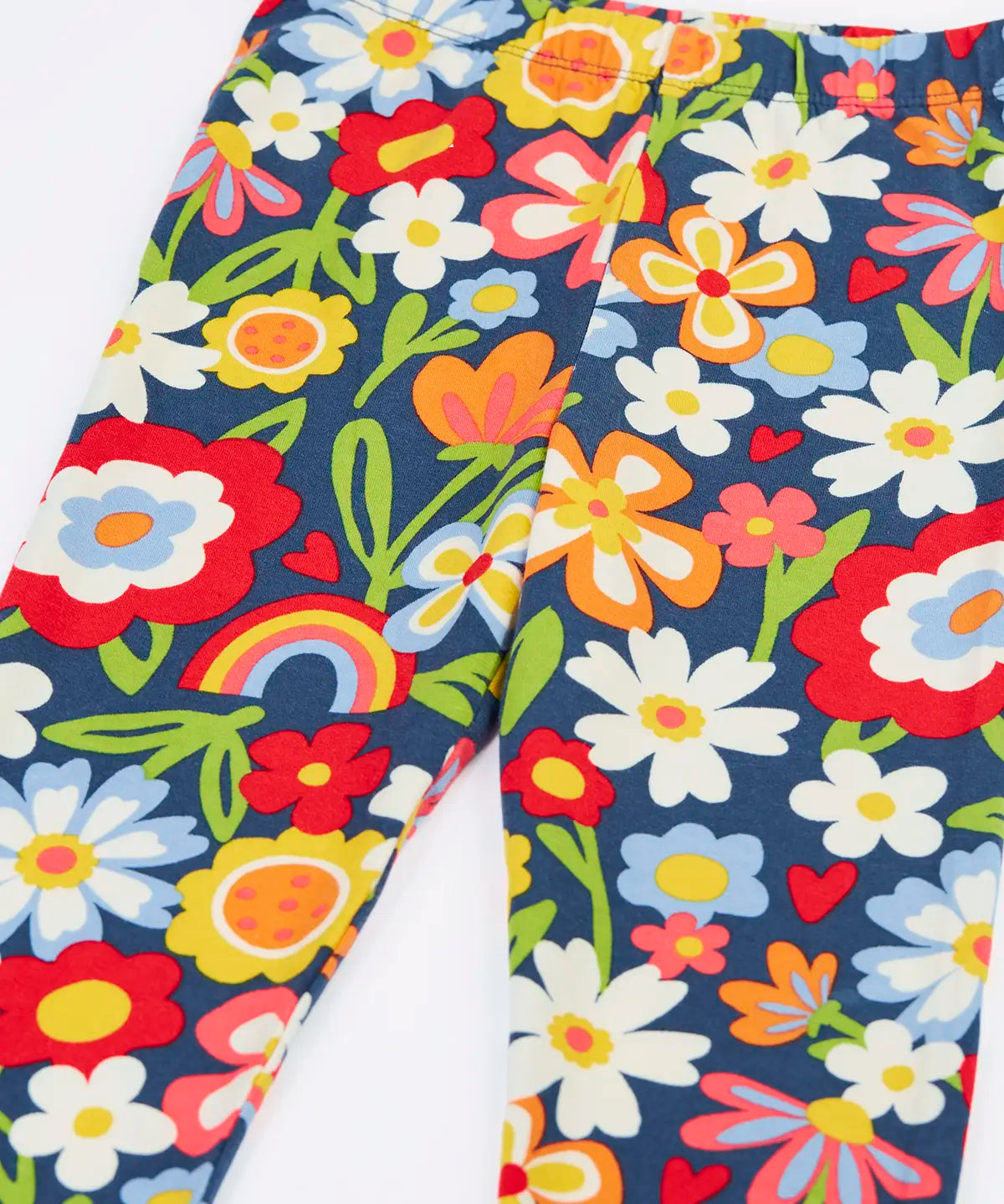 Close up of the Frugi libby beautiful bunch printed organic cotton leggings. Navy coloured background with all over flower print.