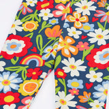 Close up of the Frugi libby beautiful bunch printed organic cotton leggings. Navy coloured background with all over flower print.